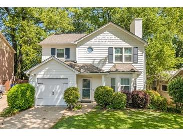 Charming two-story home with manicured lawn and inviting curb appeal in a desirable neighborhood at 1123 Seaboard Nw Ave, Atlanta, GA 30318