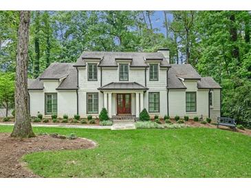 Beautiful two-story home featuring a manicured lawn and a classic architectural design at 3776 N Stratford Ne Rd, Atlanta, GA 30342