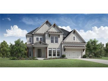 Beautiful two-story home with a manicured lawn, detailed trim and a two car garage at 6470 Pond View Dr, Cumming, GA 30028