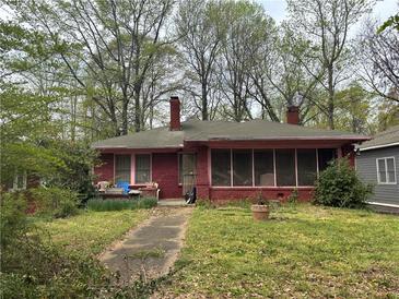 Charming brick home featuring a screened-in porch and mature trees in an established neighborhood at 349 Hopkins Sw St, Atlanta, GA 30310