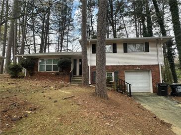 Charming two-story home with brick accents and a well-manicured front yard, perfect for families at 3025 Mckenzie Rd, Atlanta, GA 30344