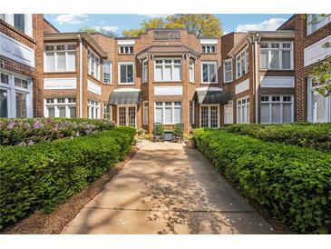 Charming brick apartment building with a well-manicured front yard and a welcoming entrance at 737 Barnett Ne St # C4, Atlanta, GA 30306