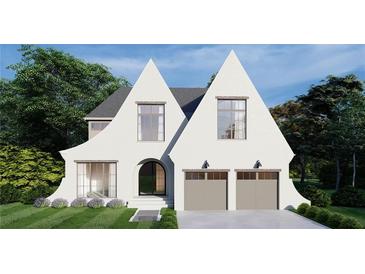 Charming, white brick home featuring unique roof peaks, modern garage doors, and a professionally landscaped yard at 1872 Georgian Terrace, Brookhaven, GA 30341
