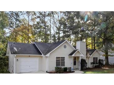 Charming single-story home featuring a well-manicured front yard and attached garage at 164 Adrian Dr, Stockbridge, GA 30281