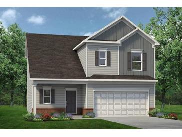 Charming two-story home with a two-car garage, landscaped front yard, and covered front porch at 28 Kensington St, Kingston, GA 30145