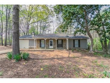 Charming single story home with stone accents and a covered front porch at 1803 Gingham Ct, Lithonia, GA 30058