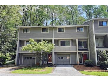 Inviting townhome showcasing attached garages, tidy landscaping, and neutral exterior paint at 2929 Torreya Se Way, Marietta, GA 30067
