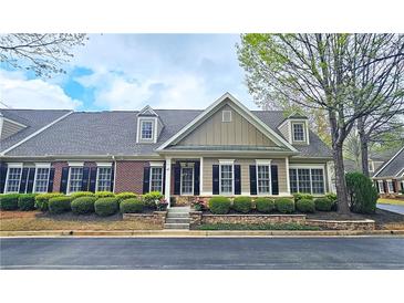 Charming home featuring a well-manicured yard with beautiful stone landscaping and classic architectural details at 625 Aunt Lucy Ln # 45, Smyrna, GA 30082