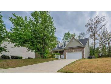 Charming home with a long driveway, inviting facade, and mature trees at 2899 Duncan Pl, Decatur, GA 30034