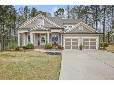 Charming home with a well-maintained front yard, two-car garage, and inviting entrance at 55 Hazelbrook Way, Acworth, GA 30101