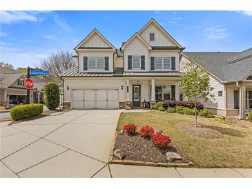 Charming two-story home with a well-manicured lawn and a two-car garage and appealing curb appeal at 340 Marietta Walk Ln, Marietta, GA 30064