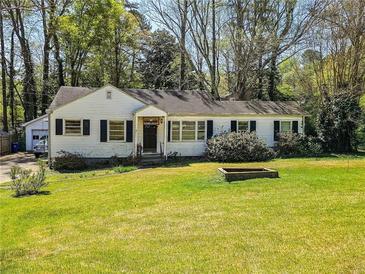 Charming home with well-maintained lawn and mature trees at 2453 Fernleaf Ln, Decatur, GA 30033