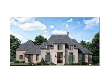 Elegant two-story home featuring stone accents, shuttered windows, and a gabled roof, set against a backdrop of trees and blue skies at 110 Godby Dr, Fayetteville, GA 30215