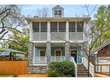 Charming two-story home with double screened porches, stone accents and a welcoming front entrance at 1643 Wade Ne Ave, Atlanta, GA 30317