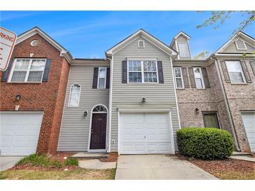 Charming townhome with a well-maintained front yard and attached one car garage at 780 Nehemiah Sw Ln # 37, Atlanta, GA 30331