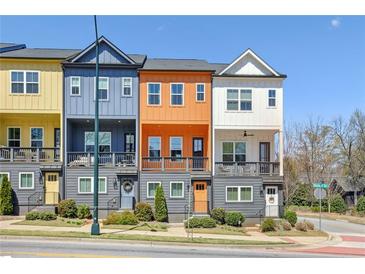 Charming townhomes with colorful exterior and lovely landscaping in a well-maintained neighborhood at 2036 Bixby Byway Se Dr, Atlanta, GA 30317