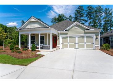 Charming single-story home with inviting porch and a two-car garage at 7 Hickory Branch, Hiram, GA 30141