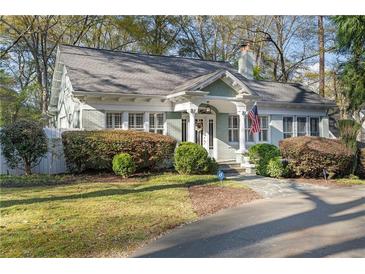 Charming traditional home with well-maintained landscaping and inviting curb appeal at 615 Collier Nw Rd, Atlanta, GA 30318