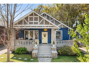 Charming blue craftsman home featuring a welcoming front porch and well-maintained landscaping at 1514 Rogers Sw Ave, Atlanta, GA 30310