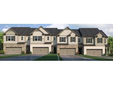 Charming townhome exteriors feature stone accents, neutral siding and attached garages at 4958 Jatoba Rd, Acworth, GA 30101