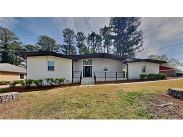 Charming single-story home with a well-manicured lawn and inviting curb appeal at 4193 Port Chester Way, Decatur, GA 30034