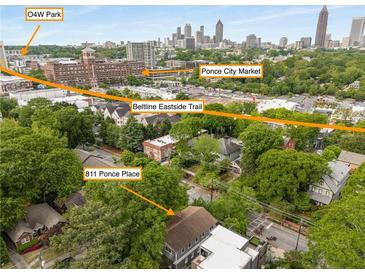 Expansive aerial view showcasing 811 Ponce Place, the Beltline Trail, Ponce City Market, and O4W Park at 811 Ponce De Leon Ne Pl, Atlanta, GA 30306