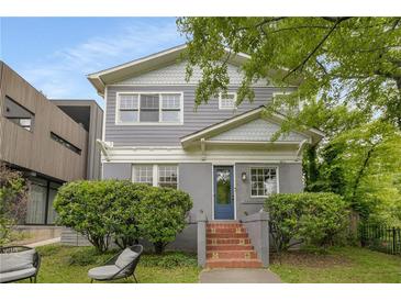 Charming two-story home with a well-maintained gray exterior, classic architecture, and a welcoming front entrance at 811 Ponce De Leon Ne Pl, Atlanta, GA 30306