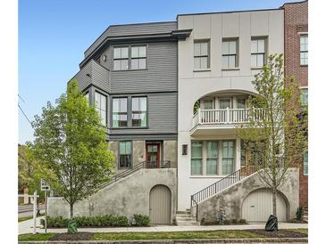 Stunning two-story home featuring unique architecture, dual staircases, and a charming balcony at 8 Bass Se St, Atlanta, GA 30315