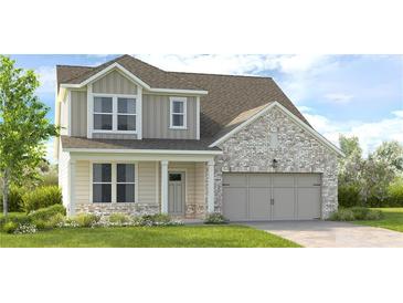Charming two-story home featuring a covered porch and attached two-car garage at 1763 Fawlocke Run, Loganville, GA 30052