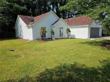 Charming one-story home features a well-maintained lawn and brick exterior at 4093 Chapel Mill Bnd, Decatur, GA 30034