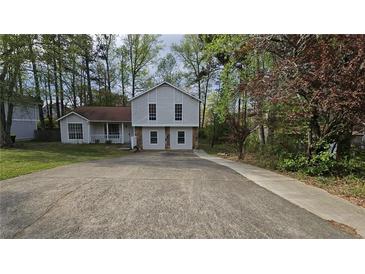 Charming two-story home with a long driveway and well-maintained landscaping at 890 Shiloh Ridge Nw Run, Kennesaw, GA 30144