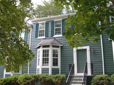 Inviting home featuring a bay window and classic green shutters at 3516 Ashley Station Sw Dr, Marietta, GA 30008