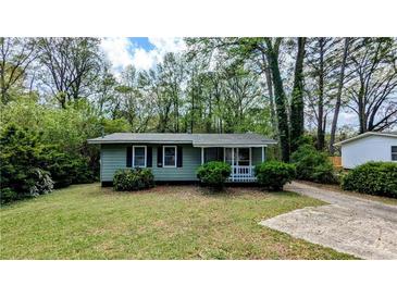 Charming single-story home with a well-maintained lawn and mature trees at 1076 Fairburn Nw Rd, Atlanta, GA 30331