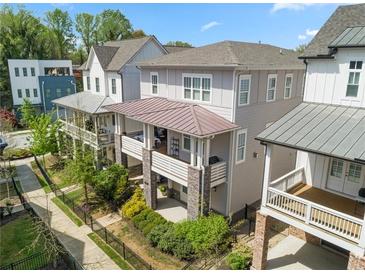 Charming townhomes boast covered porches, stone accents, and manicured landscaping at 914 Martin Nw St, Atlanta, GA 30318