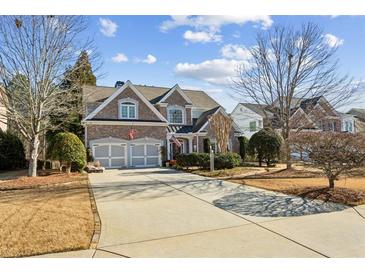 Beautiful two-story brick home featuring a spacious driveway and a two-car garage at 1239 Bonshaw Trl, Marietta, GA 30064