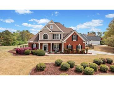 Charming two-story home with manicured lawn and brick and siding exterior at 179 Country Club Dr, Hiram, GA 30141