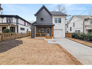 Two-story home with a two-tone exterior and modern design features at 2018 Presley Ne Way, Atlanta, GA 30317