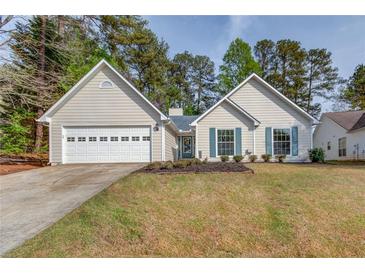Charming single-Gathering home featuring a two-car garage and well-manicured front lawn at 2643 Herndon Nw Rd, Lawrenceville, GA 30043