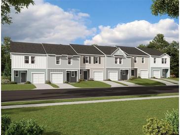 New townhomes showcasing a variety of colors, gray roofs, and garages at 2534 Coventry Street, Atlanta, GA 30331