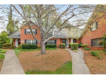 Charming brick townhouse with well-maintained landscaping and inviting walkways at 3264 Henderson Mill Rd # C, Atlanta, GA 30341
