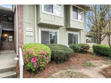 Inviting exterior of a two story building with well-maintained landscaping and blooming azaleas at 2112 Palmyra Dr, Marietta, GA 30067