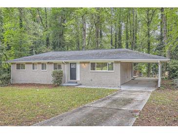 Charming single-story brick home with a carport and well-maintained front yard at 2184 Pemberton Sw Rd, Atlanta, GA 30331