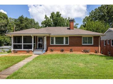 Charming red brick home with a cozy screened-in porch and well-manicured lawn at 417 Lynnhaven Sw Dr, Atlanta, GA 30310