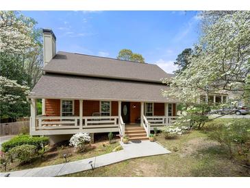 Charming home with a welcoming front porch and well-maintained landscaping at 3097 Sycamore Ln, Marietta, GA 30066
