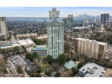 Stunning aerial view of the condo with tennis court, parking, and luxurious outdoor pool at 2870 Pharr Court South Nw # 1209, Atlanta, GA 30305