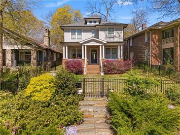 Charming two-story home with a landscaped front yard and inviting front porch at 1054 Euclid Ne Ave, Atlanta, GA 30307