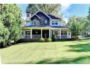 Charming two-story home featuring a welcoming front porch and well-manicured lawn at 2962 Norman Cir, Duluth, GA 30096