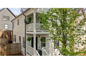 Charming two-story home with a front porch and beautiful landscaping at 770 Reed Se St, Atlanta, GA 30315