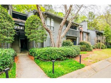 Charming condo exterior features lush landscaping and inviting walkways at 1207 Mcclelen Way, Decatur, GA 30033