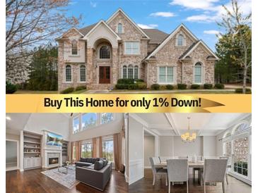 Elegant, multi-story stone house featuring a meticulously landscaped yard and a welcoming, arched entryway at 4402 Income Cir, Ellenwood, GA 30294
